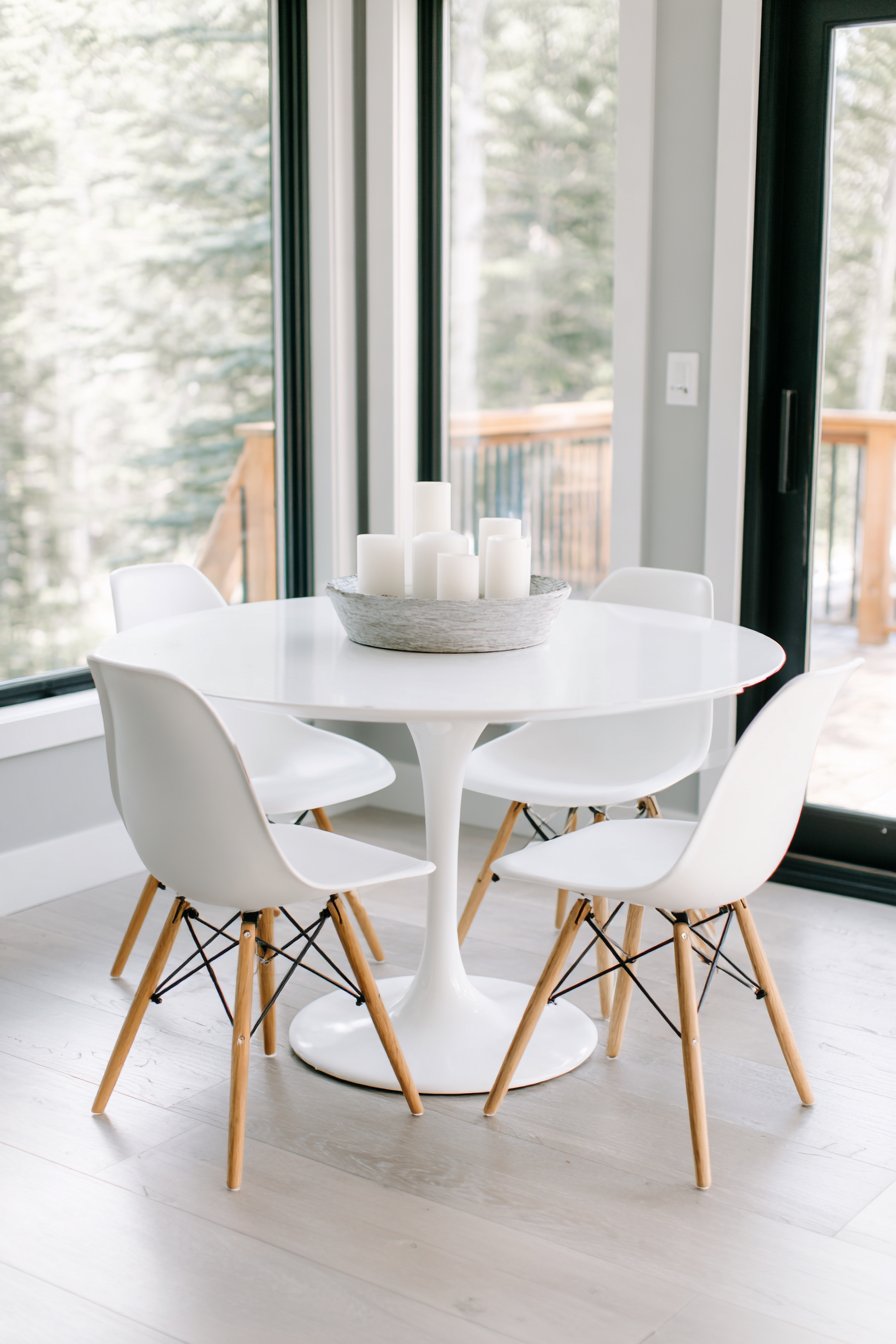 Round White Pedestal and Eames-Style Seating