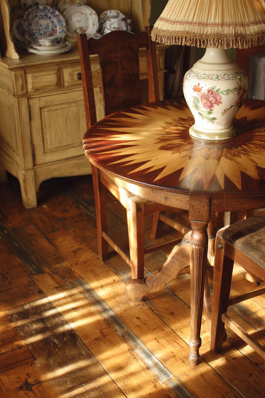 Cozy Round Walnut Table with Mismatched Chairs