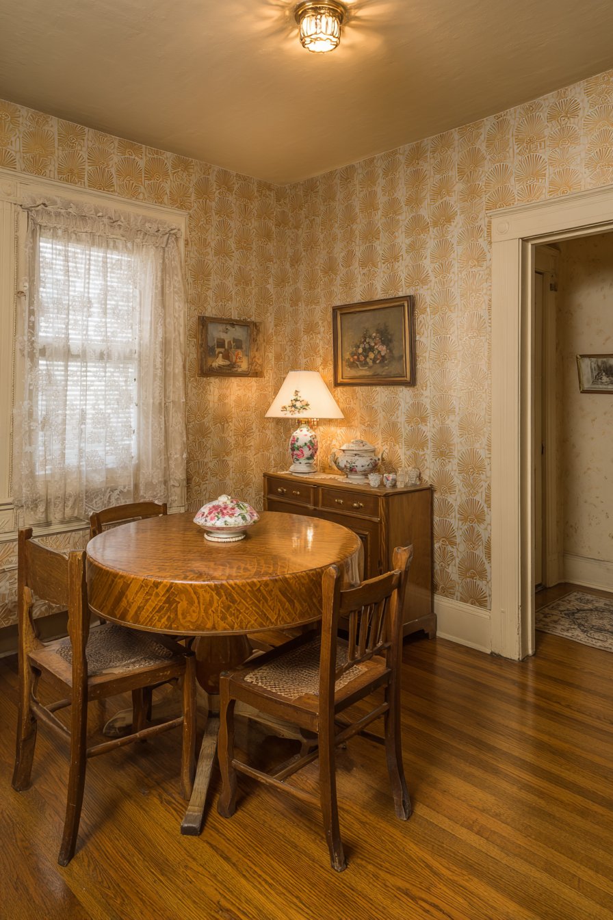 Cozy Round Walnut Table with Mismatched Chairs
